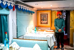 Palace on Wheels Maharaja Resaurant with smiling attendant at your service